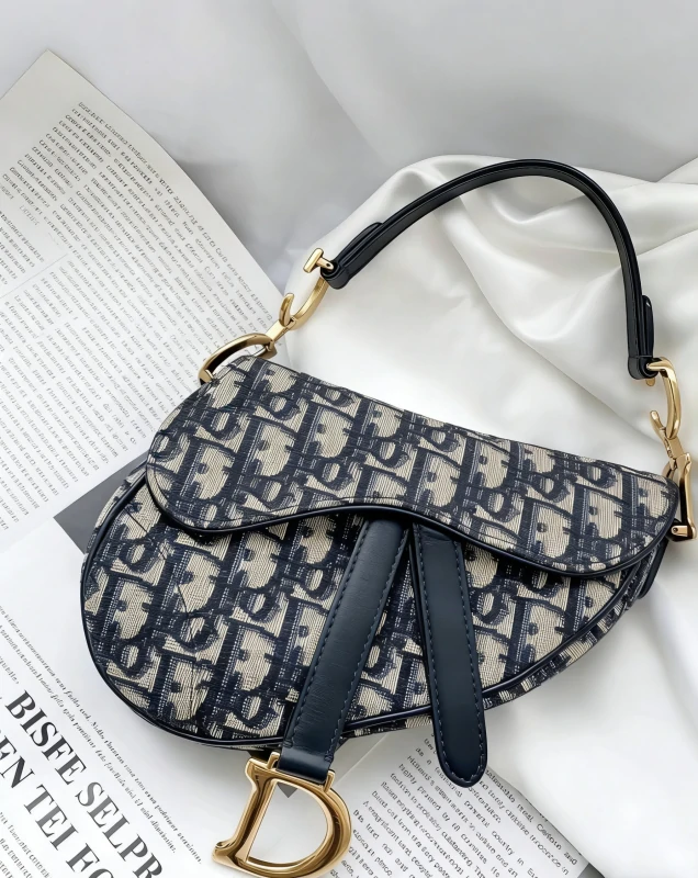 Authentic vintage Dior Saddle bag in navy blue monogram canvas.